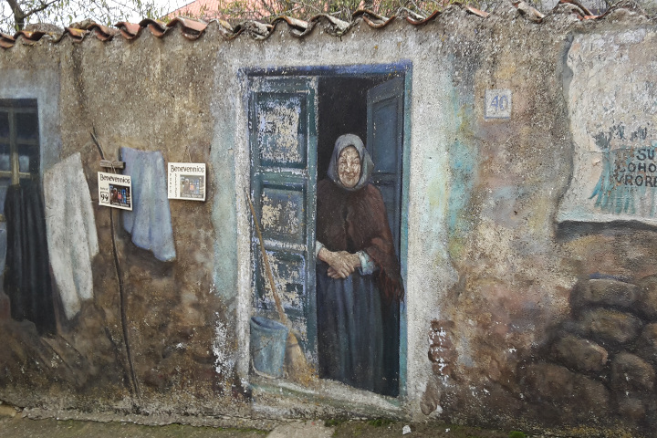 Murales of an old woman in Fonni